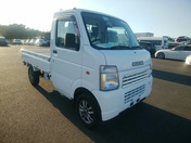 It is a picture of the white suzuki carry  truck in 2006,First Photo Stock No.Y058892